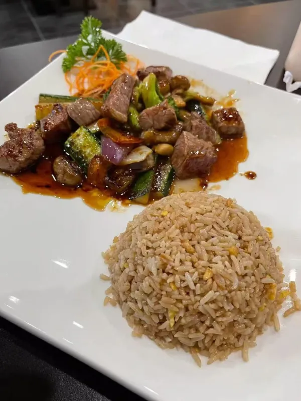 Stir-fried beef cubes with veggies and fried rice at Mirai Sushi & Thai, a Sushi Restaurant in Lucie